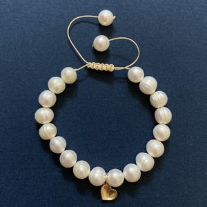 دستبند طلا 18 عیار زنانه الماسین آذر طرح قلب و مروارید کد ghalb600